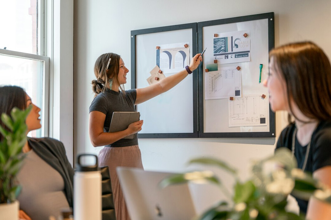 woman presenting to executives